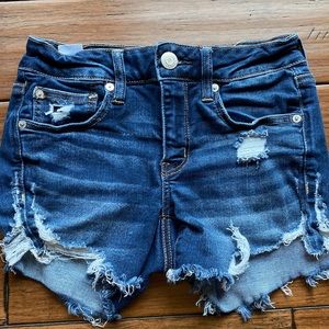 dark wash blue distressed denim shorts